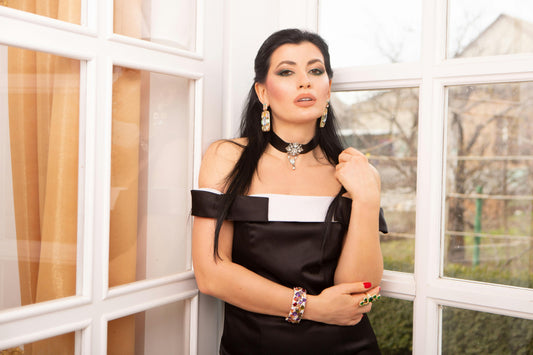 Elegant woman wearing a black dress at a romantic evening dinner – Valentine’s Day outfit inspiration